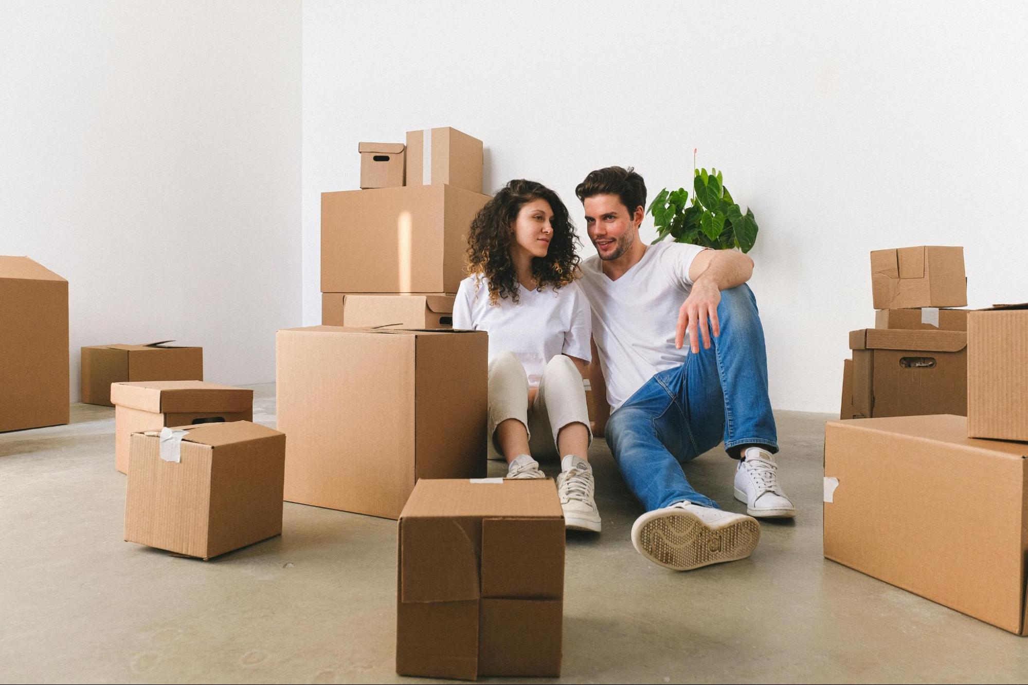 a tired woman surrounded by moving boxes